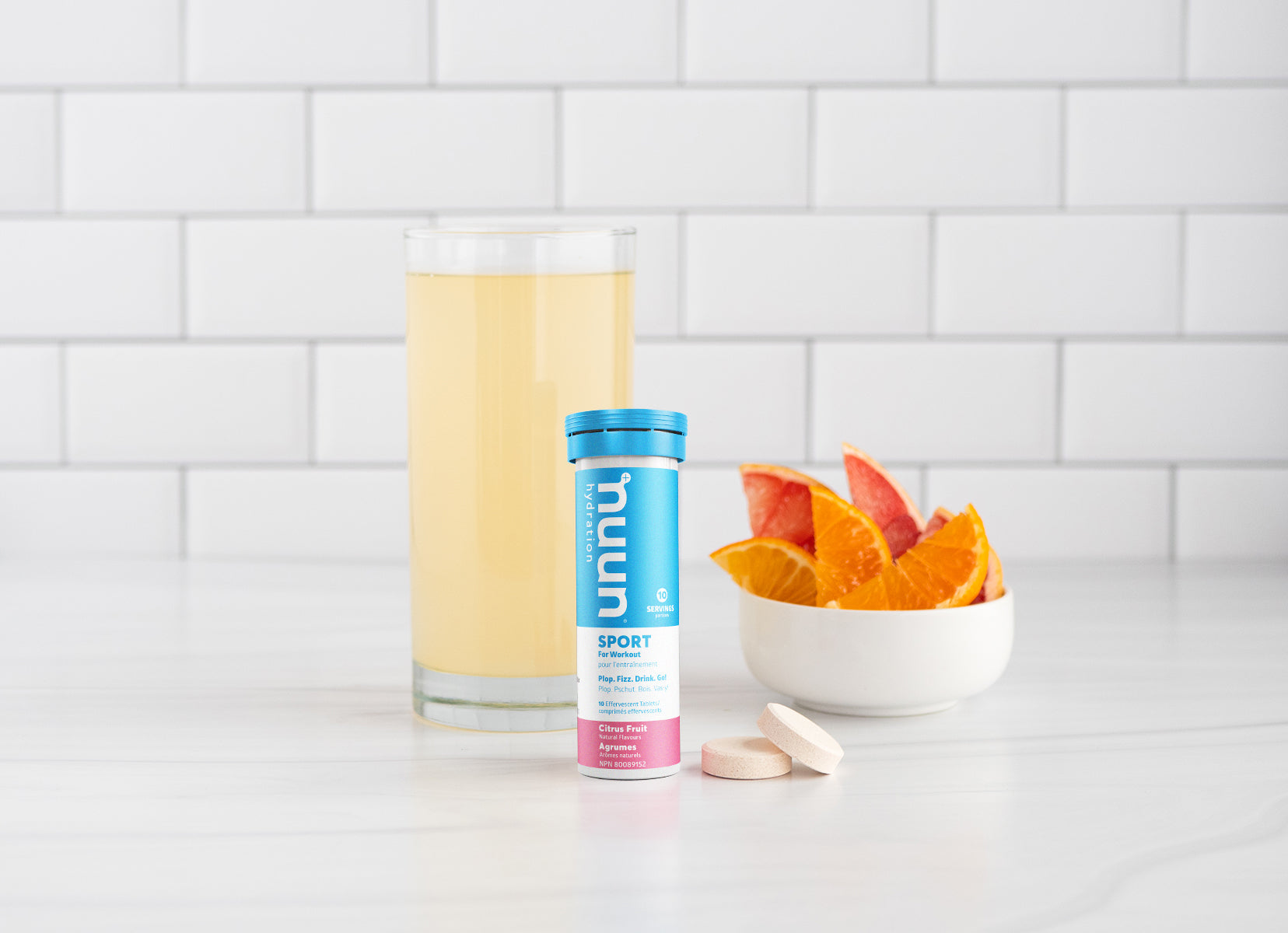 Orange slices and Nuun Hydration on a countertop