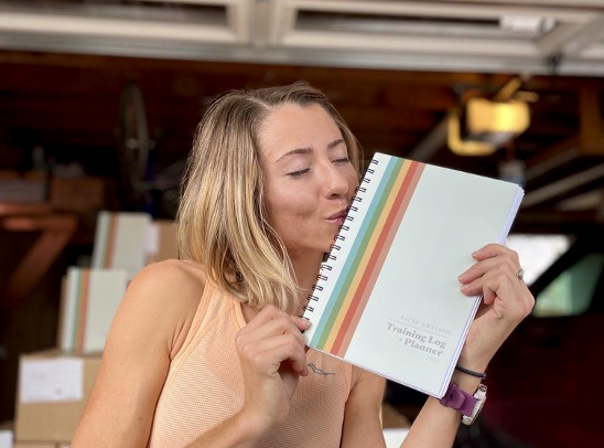 Grayson Murphy playfully kisses her planner 