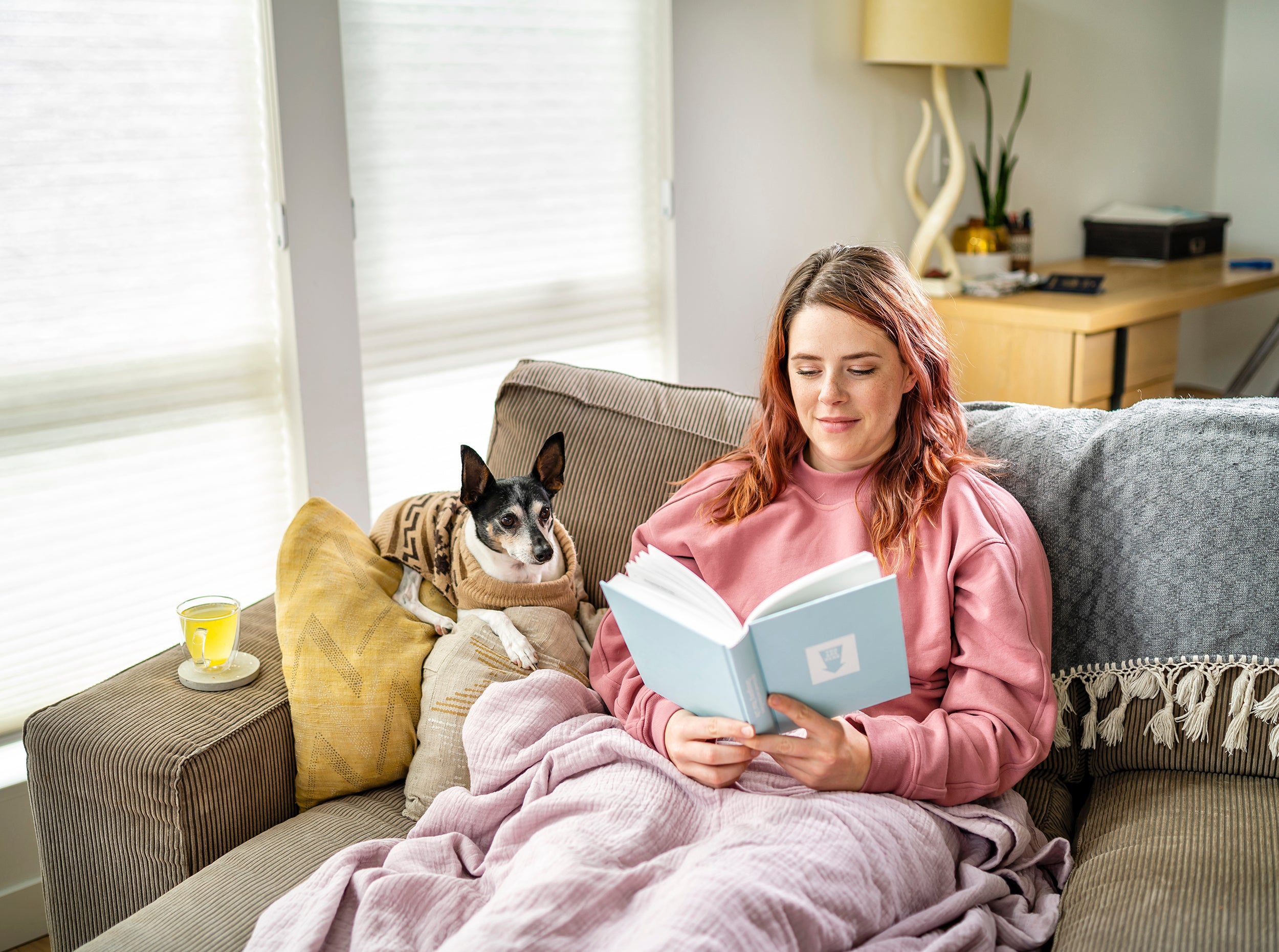 A person relaxing on the couch with Nuun