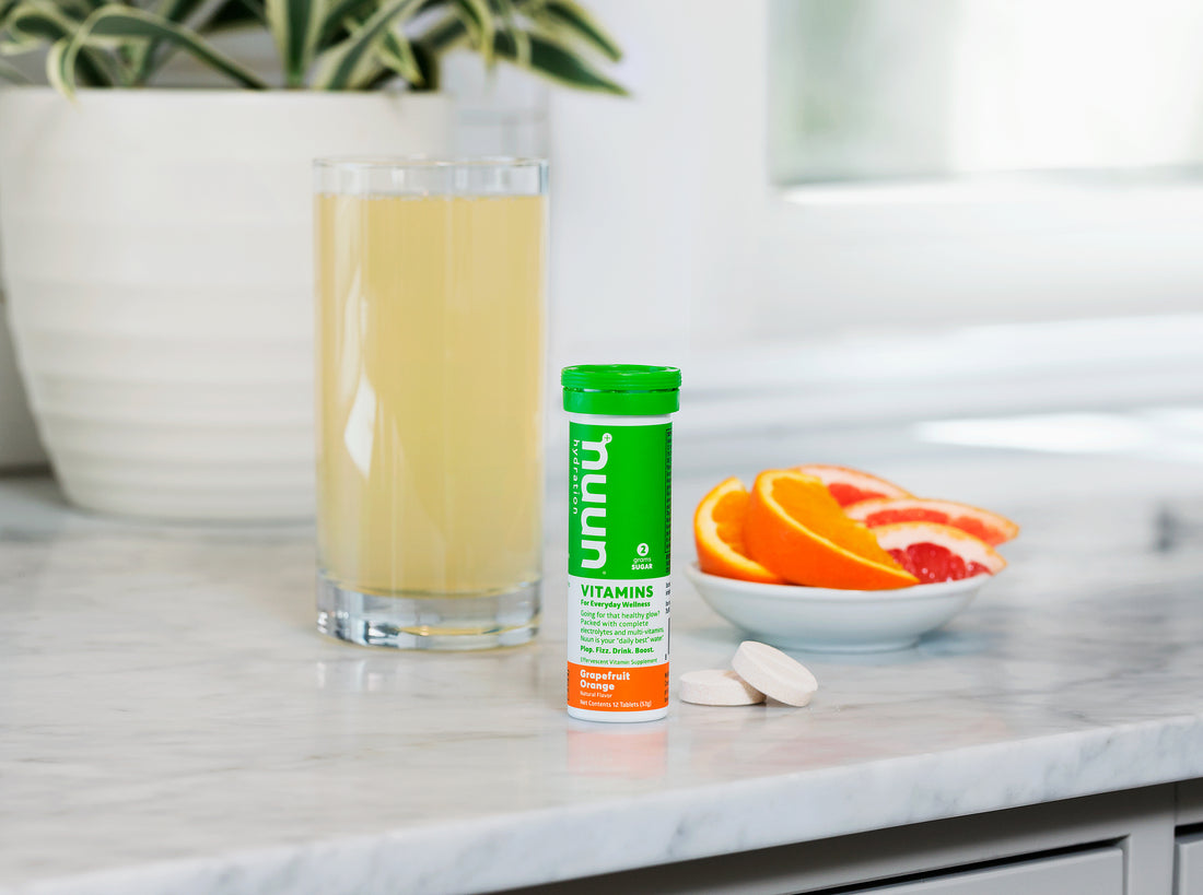 Nuun Vitamins and fresh fruit on a countertop 