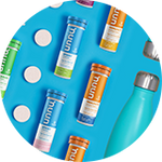 Assorted Nuun tubes and tablets on a blue background.